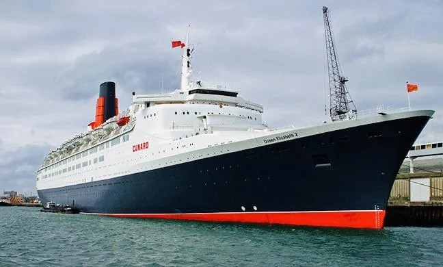 Queen Elizabeth 2 at sea, representing James Viscardini's early commercial engineering experience with Cunard